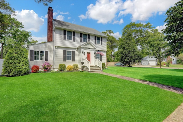 170 Little E Neck Rd S, Babylon, NY 11702 - colonial-style house featuring a chimney and a front lawn