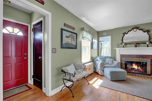 170 Little E Neck Rd S, Babylon, NY 11702 - foyer with a fireplace, hardwood / wood-style flooring, radiator heating unit, and baseboards