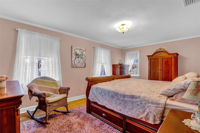 170 Little E Neck Rd S, Babylon, NY 11702 - bedroom with crown molding, wood finished floors, and baseboards