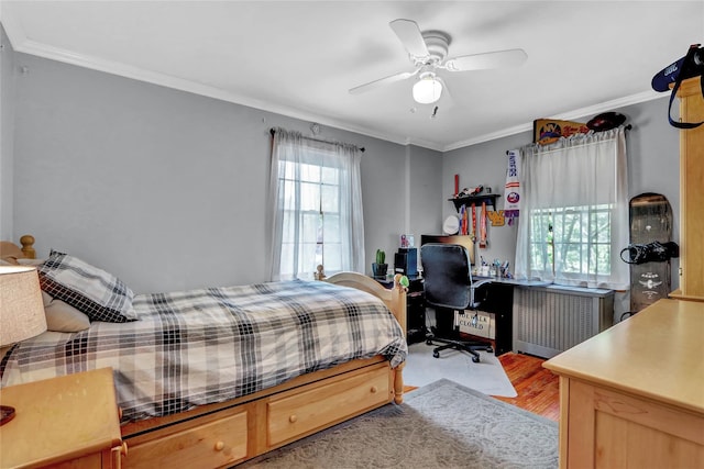 170 Little E Neck Rd S, Babylon, NY 11702 - bedroom with ornamental molding, wood finished floors, a desk, and ceiling fan