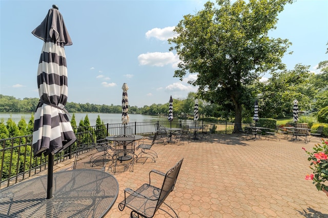 32 Manchester Rd Unit # B26, Eastchester, NY 10709 - view of patio with a water view, view of wooded area, and outdoor dining area