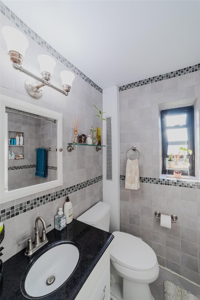 32 Manchester Rd Unit # B26, Eastchester, NY 10709 - half bath with tile walls, toilet, vanity, and decorative backsplash