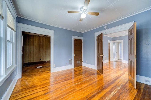 5 Gray Sts, Poughkeepsie, NY 12601 - unfurnished room featuring wood-type flooring, a ceiling fan, ornamental molding, baseboards, and a smoke detector
