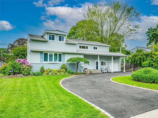 964 Manor Ln, Bay Shore, NY 11706 - view of front of house featuring driveway, a garage, and brick siding