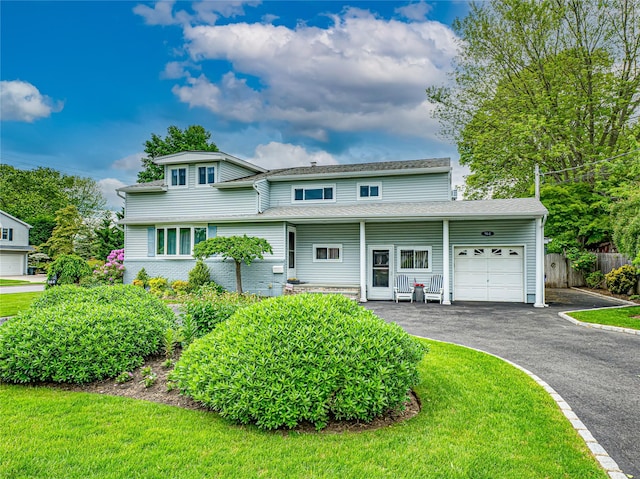 964 Manor Ln, Bay Shore, NY 11706 - view of front of home featuring a garage, driveway, and a porch