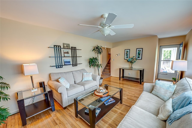 964 Manor Ln, Bay Shore, NY 11706 - living area featuring stairway, a ceiling fan, wood finished floors, and baseboards