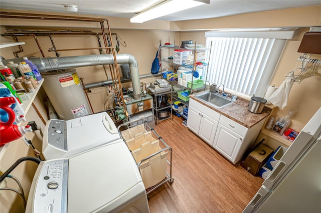 964 Manor Ln, Bay Shore, NY 11706 - basement with washer / clothes dryer, a sink, light wood-style floors, and gas water heater