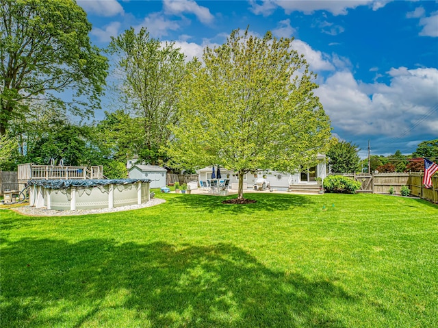 964 Manor Ln, Bay Shore, NY 11706 - view of yard featuring a covered pool and a patio area