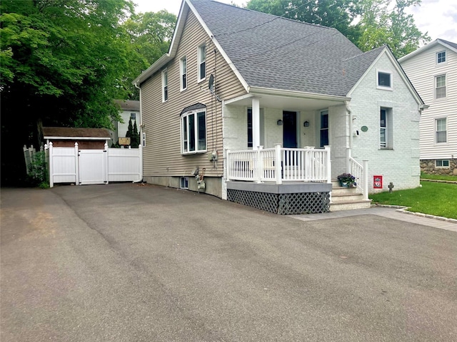 29 Chestnut St, Pearl River, NY 10965 - view of front of house featuring covered porch and roof with shingles