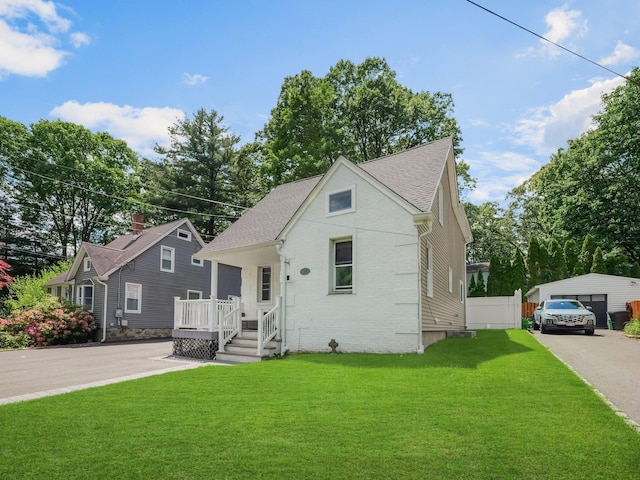 29 Chestnut St, Pearl River, NY 10965 - bungalow-style home featuring a front lawn, brick siding, a garage, and a shingled roof