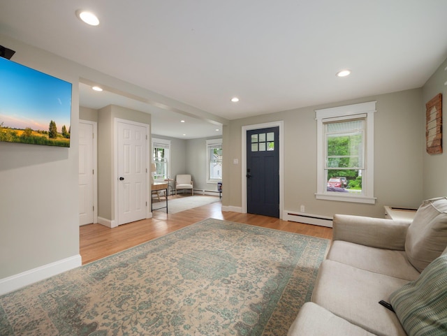 29 Chestnut St, Pearl River, NY 10965 - living area featuring a baseboard radiator, healthy amount of natural light, wood finished floors, recessed lighting, and baseboards