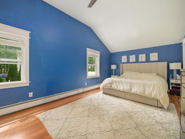 29 Chestnut St, Pearl River, NY 10965 - bedroom with vaulted ceiling, wood finished floors, a baseboard radiator, and ceiling fan