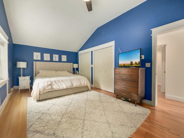 29 Chestnut St, Pearl River, NY 10965 - bedroom featuring multiple closets, lofted ceiling, baseboards, wood finished floors, and ceiling fan