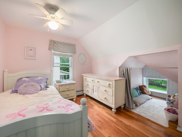 29 Chestnut St, Pearl River, NY 10965 - bedroom featuring lofted ceiling, light wood-style floors, a baseboard heating unit, and ceiling fan