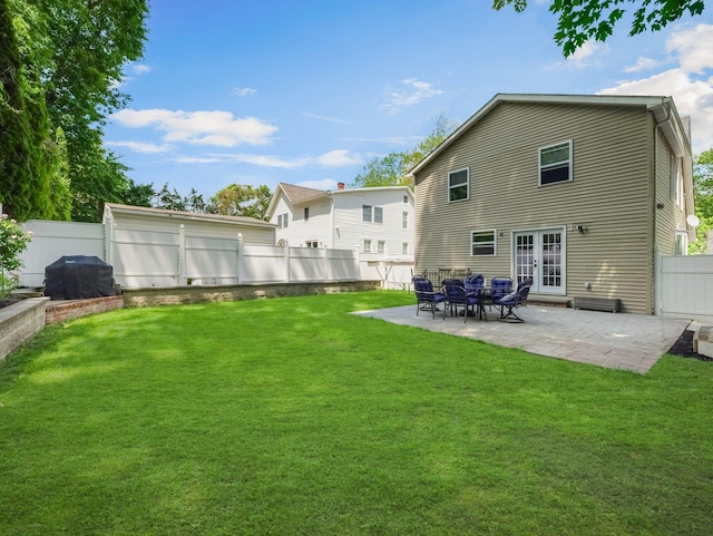29 Chestnut St, Pearl River, NY 10965 - rear view of house featuring french doors and a patio area