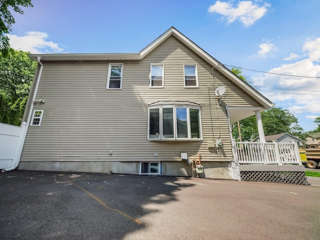 29 Chestnut St, Pearl River, NY 10965 - rear view of house featuring covered porch