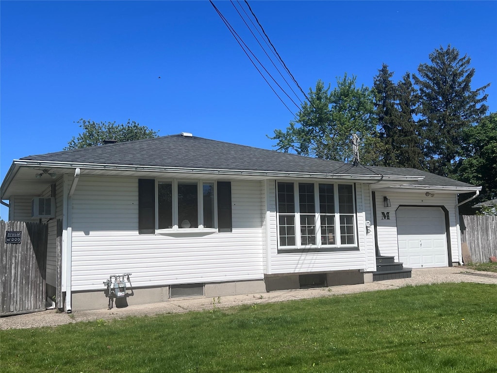 68 Ruland Rd, Selden, NY 11784 - view of front of property featuring an attached garage, a shingled roof, and driveway