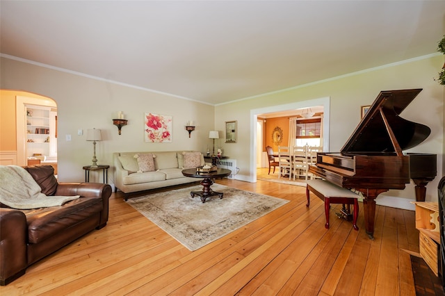 70 Loines Ave, Merrick, NY 11566 - living area featuring ornamental molding, arched walkways, wood-type flooring, and baseboards