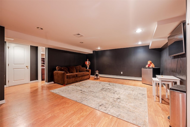 70 Loines Ave, Merrick, NY 11566 - living area featuring a baseboard radiator, light wood-type flooring, recessed lighting, and baseboards