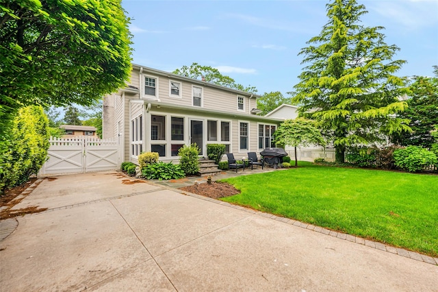 70 Loines Ave, Merrick, NY 11566 - rear view of property featuring a gate, entry steps, a patio, and a chimney