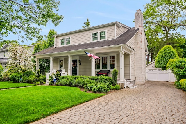 70 Loines Ave, Merrick, NY 11566 - view of front of house with a porch, a chimney, and roof with shingles