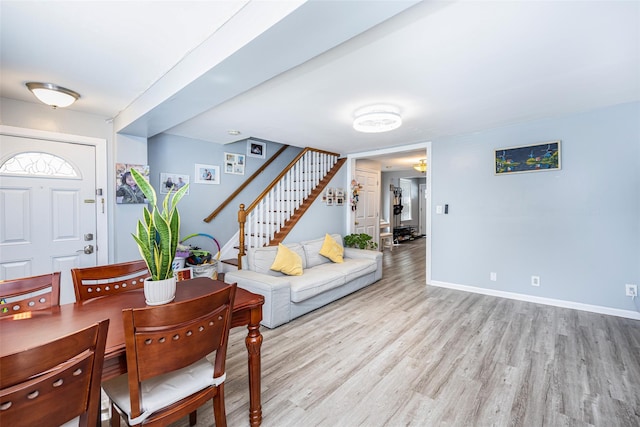 2226 124th St, College Point, NY 11356 - dining space with stairway, wood finished floors, and baseboards