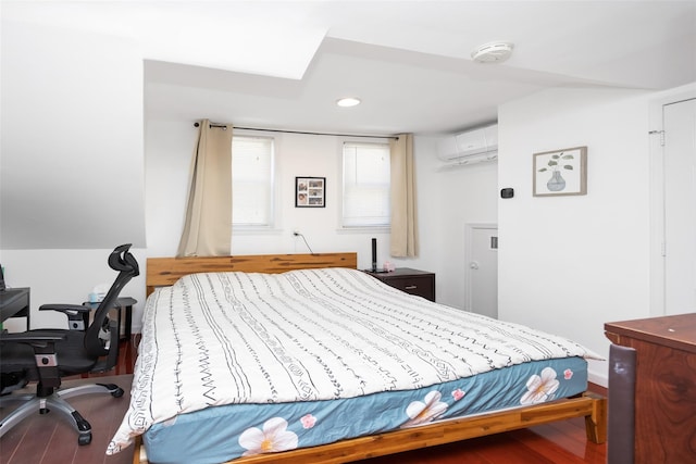 2226 124th St, College Point, NY 11356 - bedroom featuring a wall unit AC, wood finished floors, and an office area
