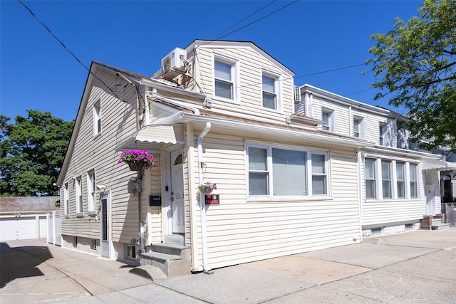 2226 124th St, College Point, NY 11356 - view of front of property featuring entry steps and a garage