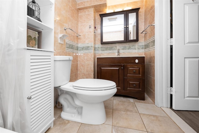 2226 124th St, College Point, NY 11356 - full bathroom with tile walls, vanity, tile patterned flooring, a tile shower, and toilet
