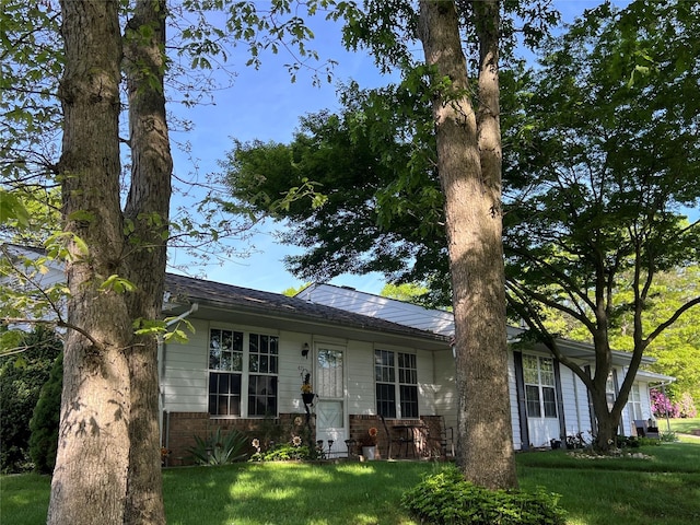 411A Weymouth Ct Unit 411A, Ridge, NY 11961 - view of front facade featuring a front yard
