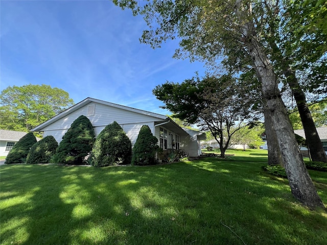 411A Weymouth Ct Unit 411A, Ridge, NY 11961 - view of property exterior featuring a lawn
