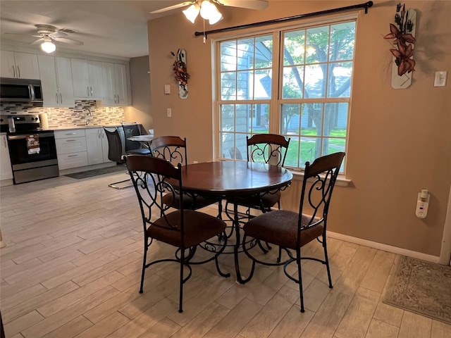 411A Weymouth Ct Unit 411A, Ridge, NY 11961 - dining room with ceiling fan, light wood-style flooring, and baseboards