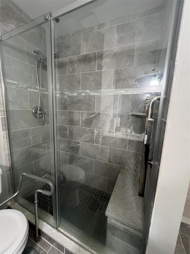 411A Weymouth Ct Unit 411A, Ridge, NY 11961 - bathroom featuring toilet and a stall shower