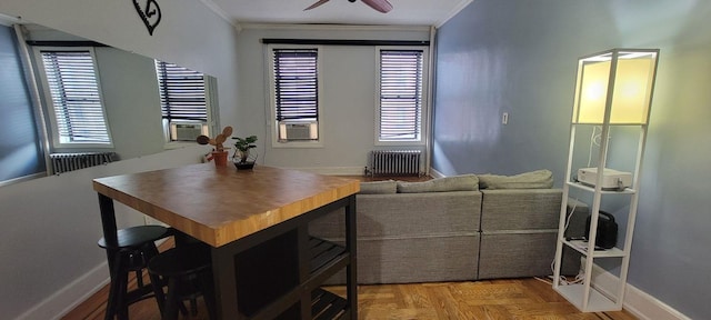 1175 Anderson Ave Unit 4D, Bronx, NY 10452 - dining area featuring radiator, crown molding, baseboards, plenty of natural light, and ceiling fan