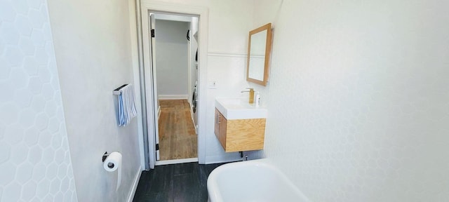 1175 Anderson Ave Unit 4D, Bronx, NY 10452 - full bath with a freestanding tub, vanity, wood finished floors, and baseboards