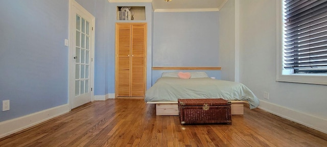 1175 Anderson Ave Unit 4D, Bronx, NY 10452 - bedroom with ornamental molding, wood finished floors, and baseboards