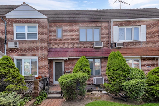 61-66 80th St, Middle Village, NY 11379 - townhome / multi-family property with brick siding and cooling unit