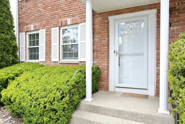 554 Kensico Ct, Suffern, NY 10901 - doorway to property featuring brick siding and a porch