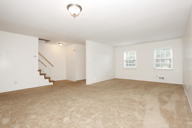 554 Kensico Ct, Suffern, NY 10901 - carpeted empty room featuring stairway