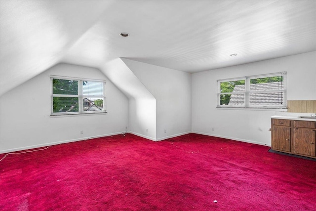 26-03 157th St, Flushing, NY 11354 - additional living space with vaulted ceiling, carpet, a sink, and baseboards