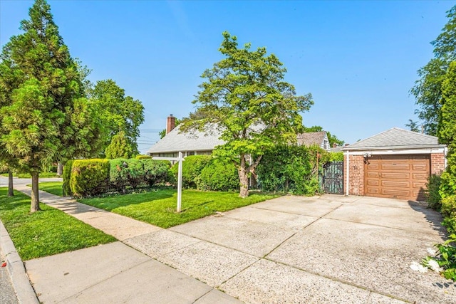 26-03 157th St, Flushing, NY 11354 - view of property hidden behind natural elements with brick siding and driveway