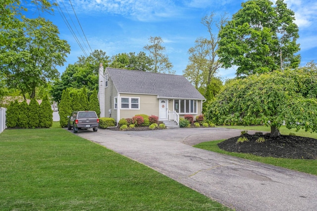 2251 Ocean Ave, Ronkonkoma, NY 11779 - view of front facade featuring asphalt driveway, a shingled roof, and a chimney