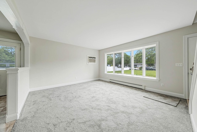 2251 Ocean Ave, Ronkonkoma, NY 11779 - carpeted empty room featuring a baseboard heating unit and baseboards