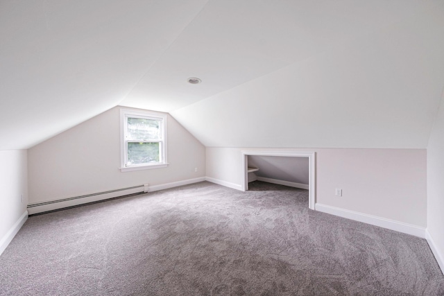 2251 Ocean Ave, Ronkonkoma, NY 11779 - bonus room with a baseboard heating unit, carpet floors, vaulted ceiling, and baseboards