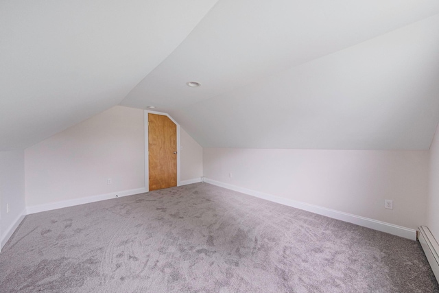 2251 Ocean Ave, Ronkonkoma, NY 11779 - bonus room with a baseboard radiator, vaulted ceiling, carpet, and baseboards