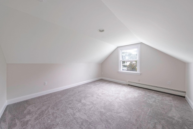 2251 Ocean Ave, Ronkonkoma, NY 11779 - bonus room with a baseboard heating unit, carpet floors, vaulted ceiling, and baseboards