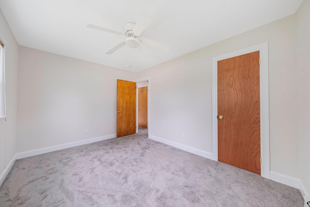 2251 Ocean Ave, Ronkonkoma, NY 11779 - unfurnished bedroom with carpet, baseboards, and ceiling fan