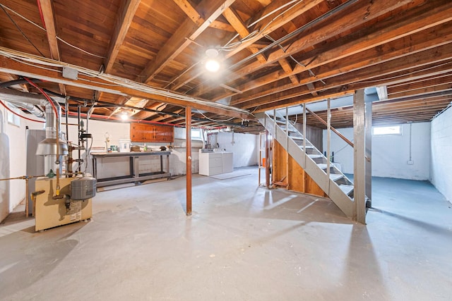 2251 Ocean Ave, Ronkonkoma, NY 11779 - basement with independent washer and dryer, stairs, and a heating unit