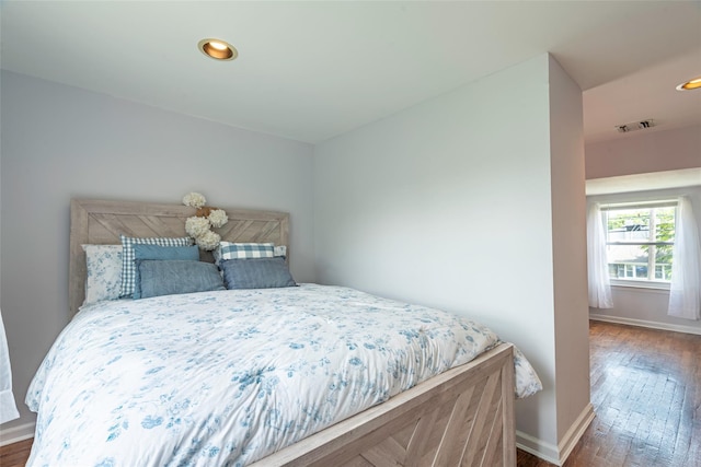 103 Woods Ave, Malverne, NY 11565 - bedroom with wood finished floors, baseboards, and recessed lighting