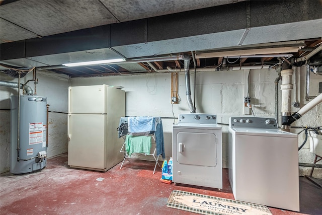 103 Woods Ave, Malverne, NY 11565 - washroom with water heater and washing machine and clothes dryer